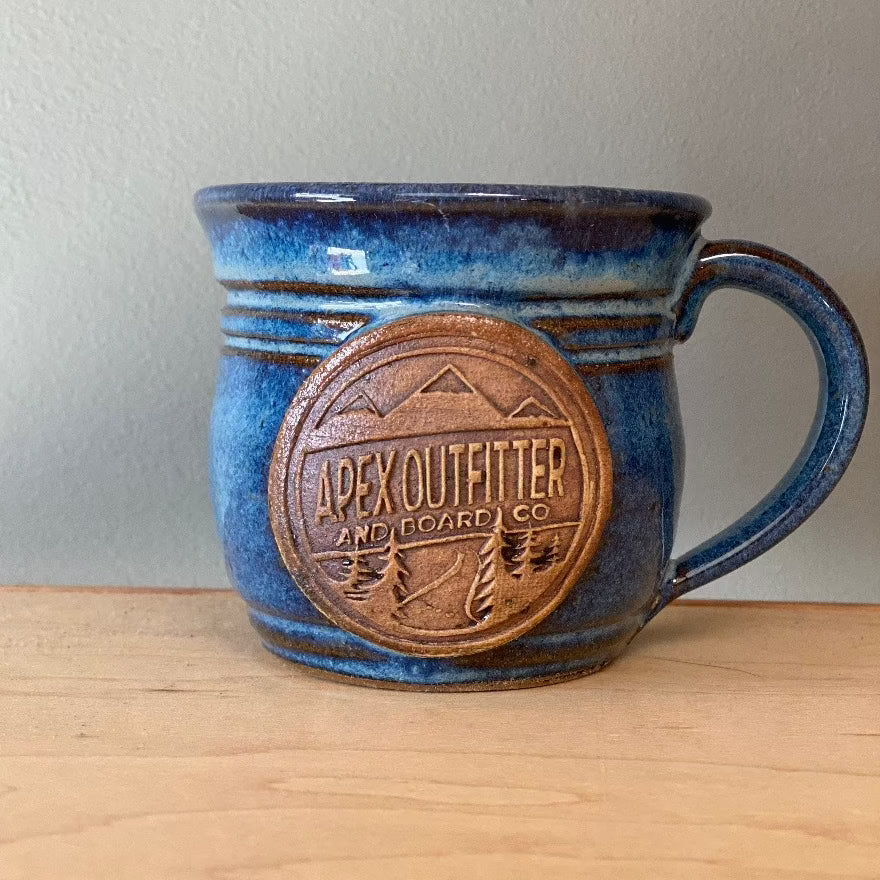 https://apexoutfitter.com/cdn/shop/products/apex-outfitter-ceramic-mug-12oz-cooking-hydration-apex-outfitter-board-co-blue-296921_900x.heic?v=1697038416